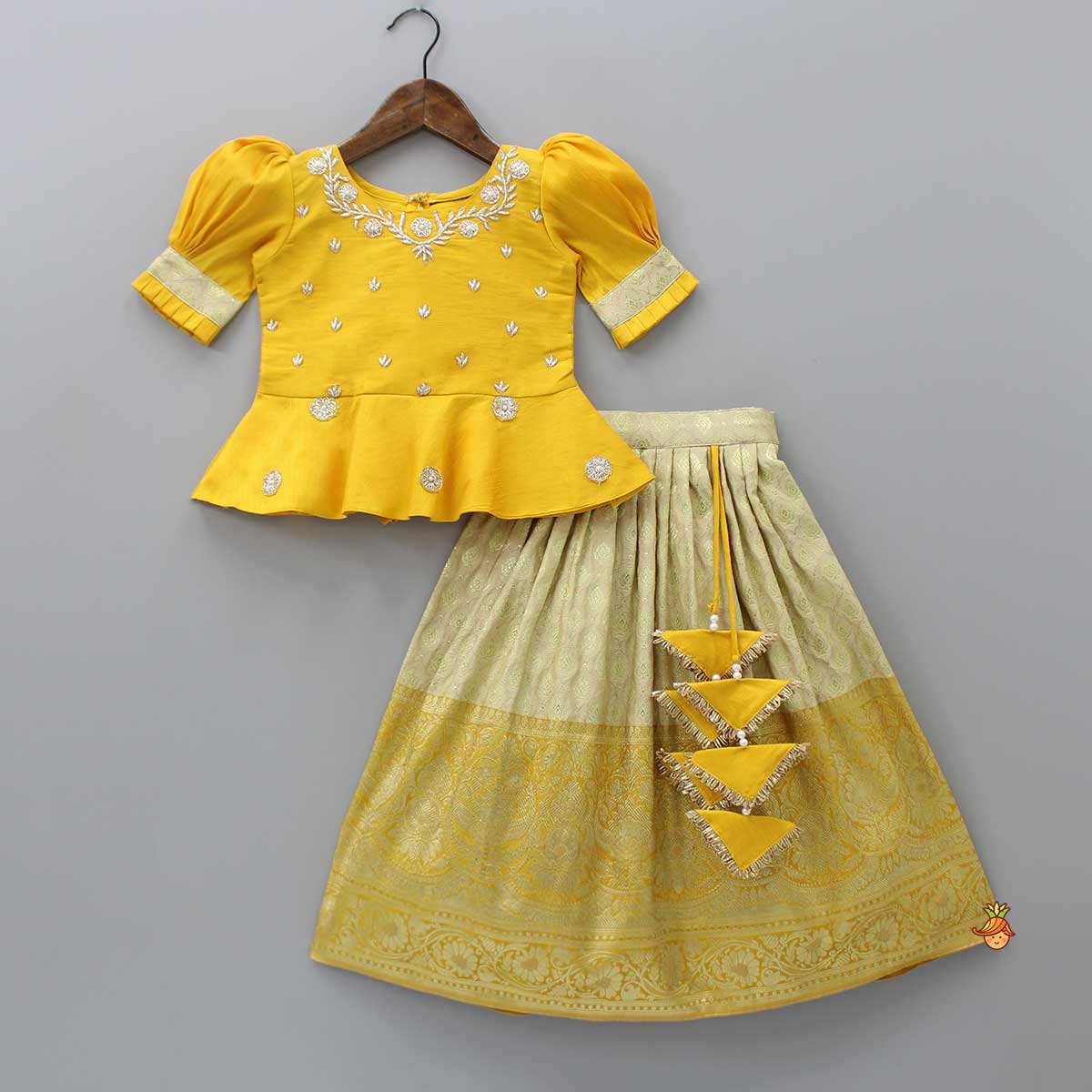 Pre Order: Beautiful Zari Floral Work And Puff Sleeves Peplum Top With Banarasi Brocade Embroidered Lehenga