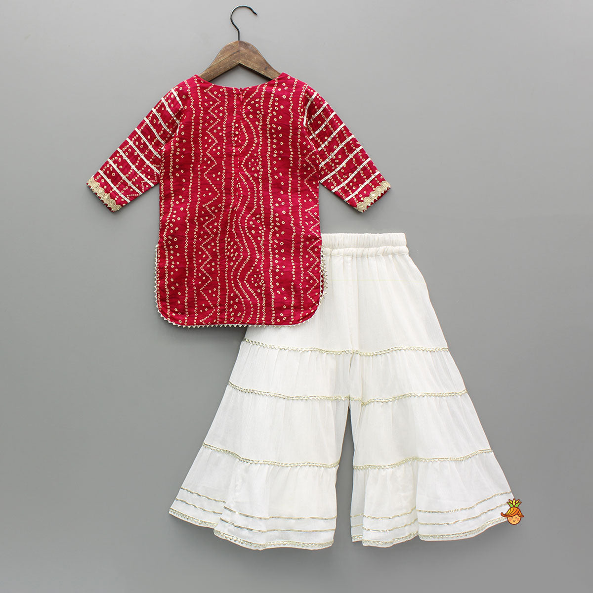 Pre Order: Bandhani Printed Pink Kurti With Off-White Sharara And Net Dupatta