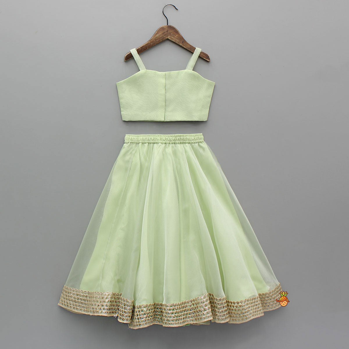 Pre Order: Floral Embroidered Green Sleeveless Top And Fabric Flower Tassels Adorned Lehenga With Ruffle Dupatta