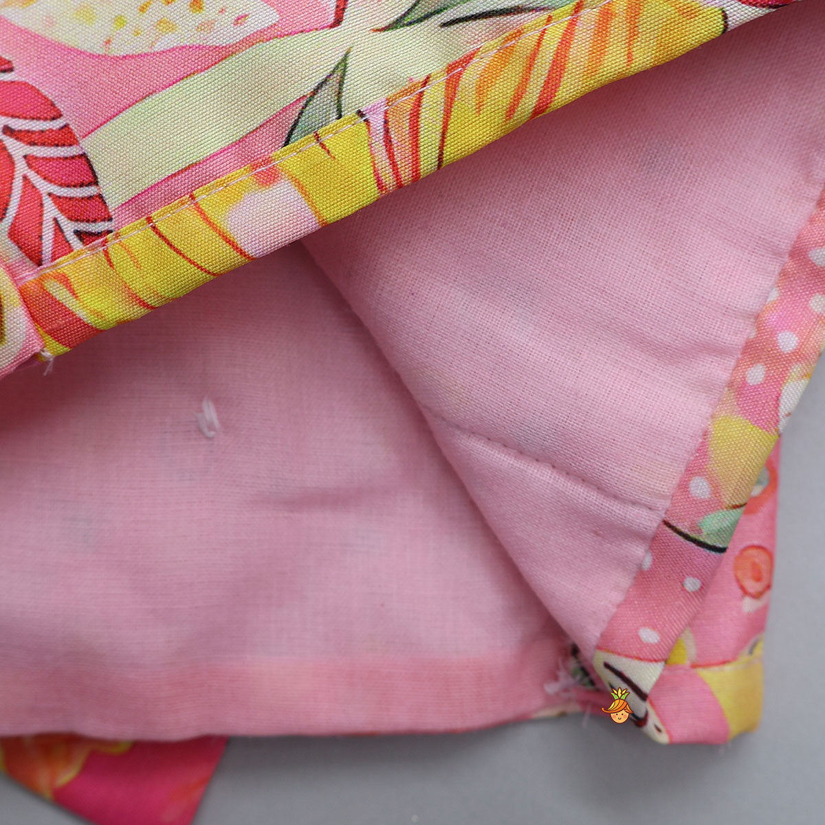 Pre Order: Buttons Adorned Pink Top And Scalloped Lace Work Floral Lehenga