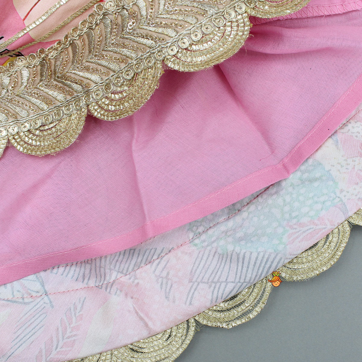Pre Order: Buttons Adorned Pink Top And Scalloped Lace Work Floral Lehenga