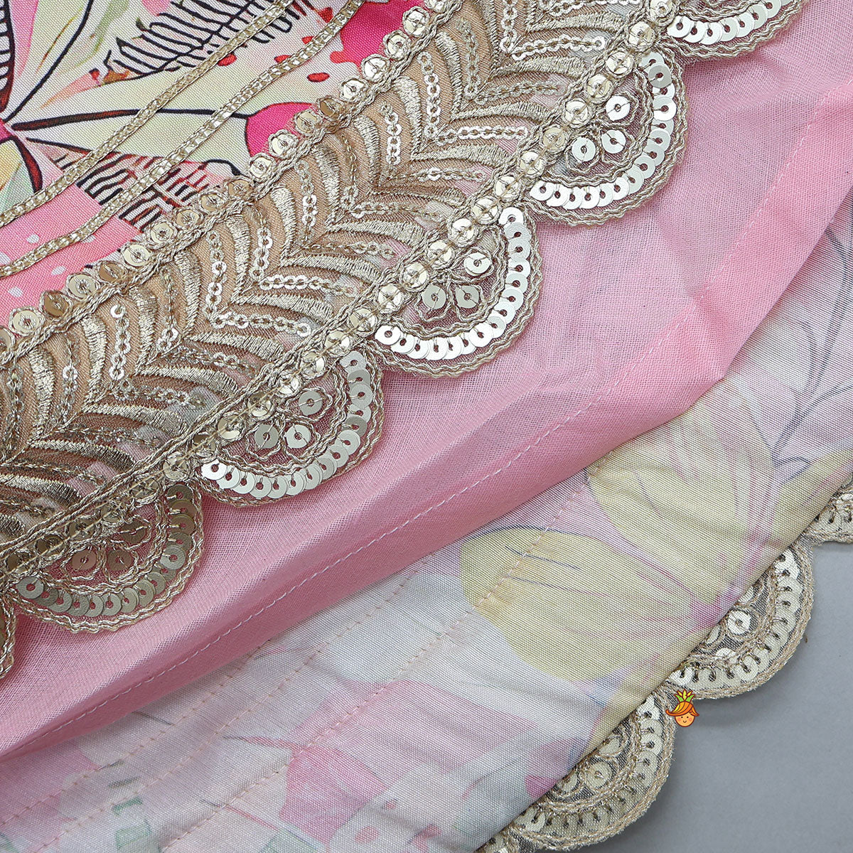 Pre Order: Buttons Adorned Pink Top And Scalloped Lace Work Floral Lehenga