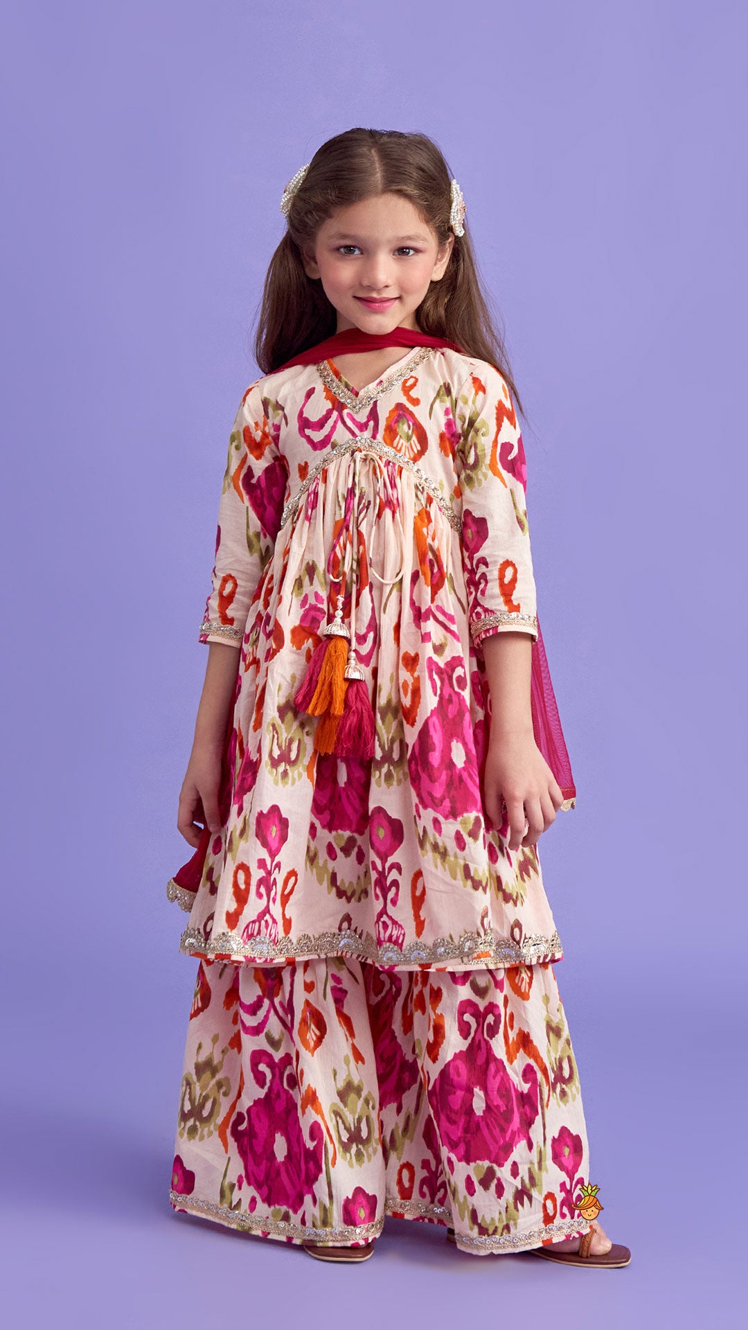 Pre Order: Tassels Enhanced Multicolour Printed Kurti And Sharara With Scalloped Lace Detail Dupatta