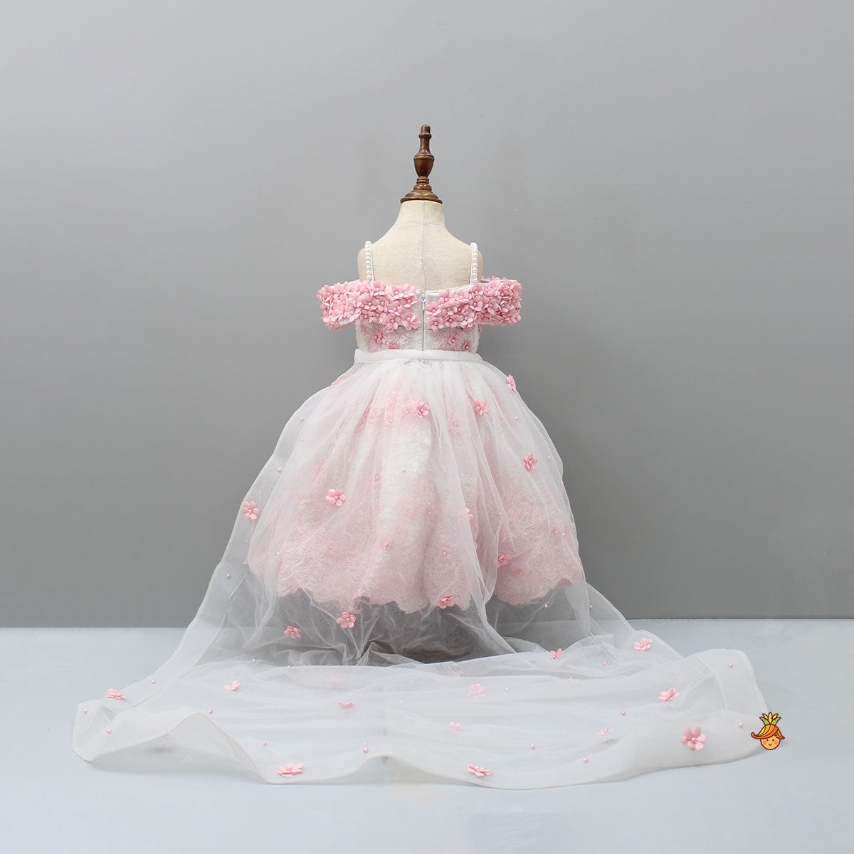 Off Shoulder Fabric Flowers Adorned Wings Gown With Detachable Trail And Matching Hair Clip