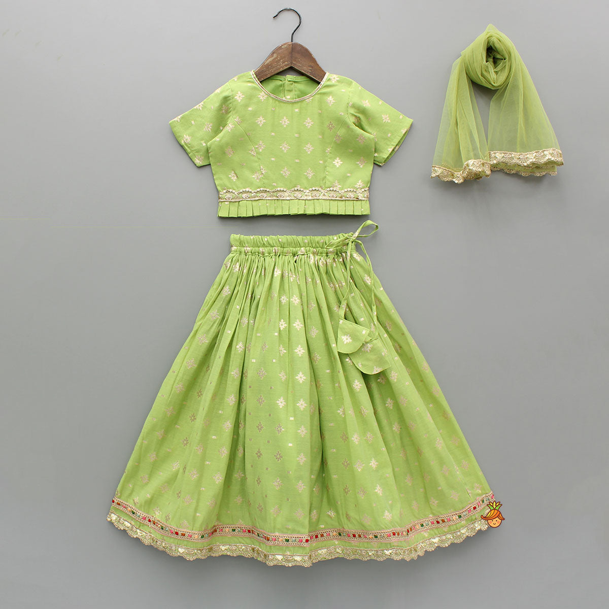 Pre Order: Pleated Hem Green Chanderi Embroidered Top And Lehenga With Net Dupatta