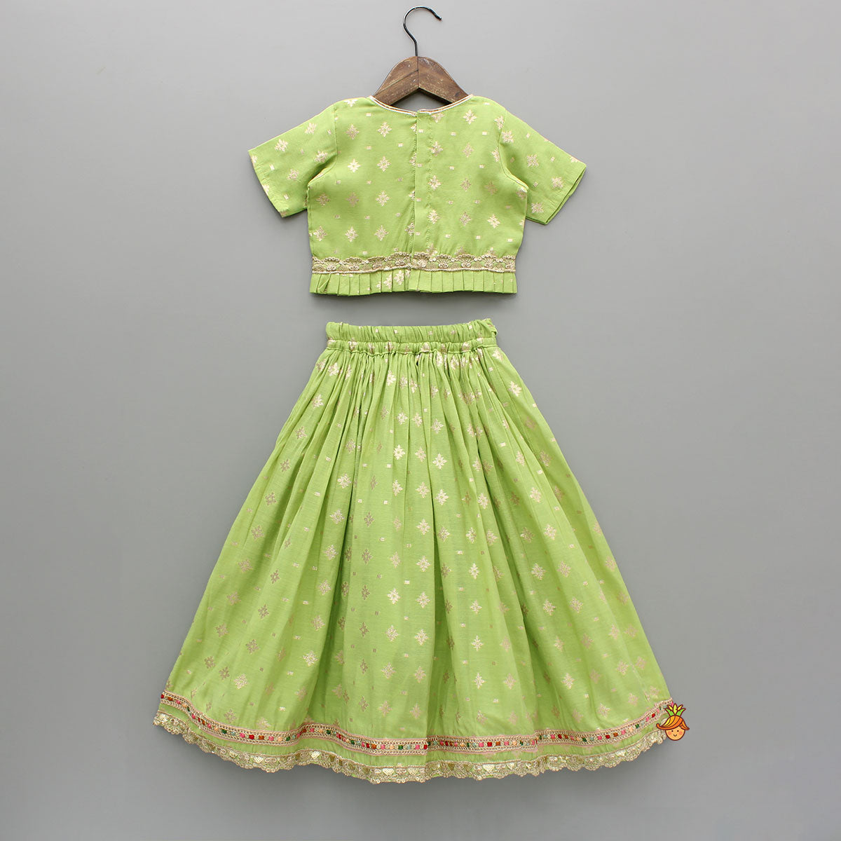 Pre Order: Pleated Hem Green Chanderi Embroidered Top And Lehenga With Net Dupatta