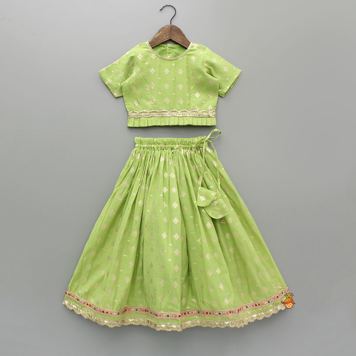 Pre Order: Pleated Hem Green Chanderi Embroidered Top And Lehenga With Net Dupatta