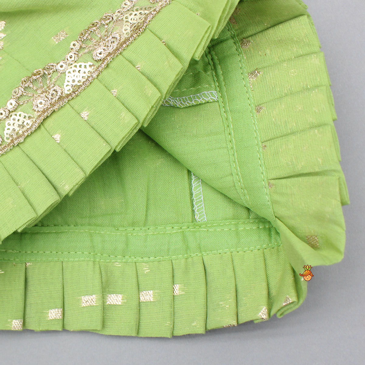 Pre Order: Pleated Hem Green Chanderi Embroidered Top And Lehenga With Net Dupatta