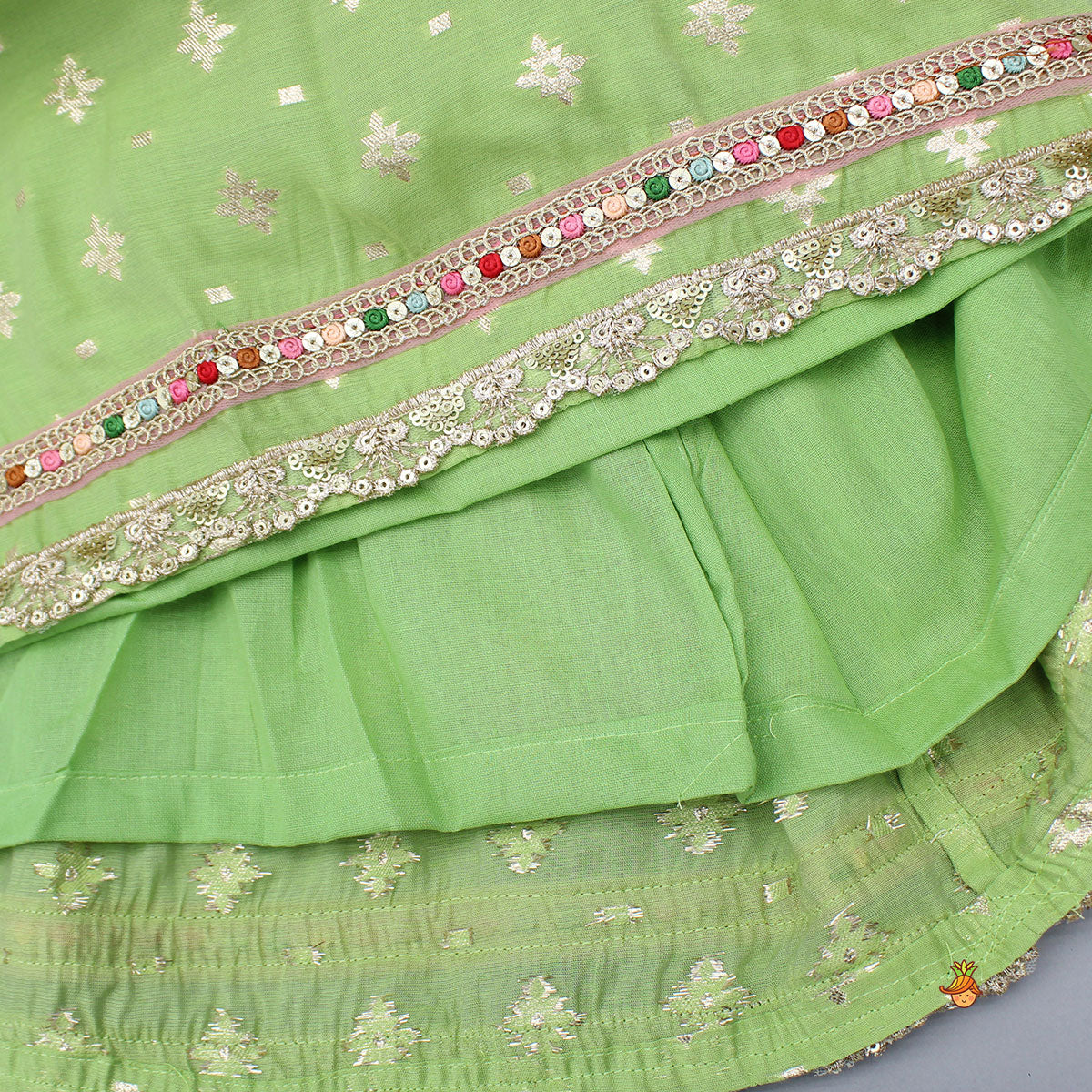 Pre Order: Pleated Hem Green Chanderi Embroidered Top And Lehenga With Net Dupatta