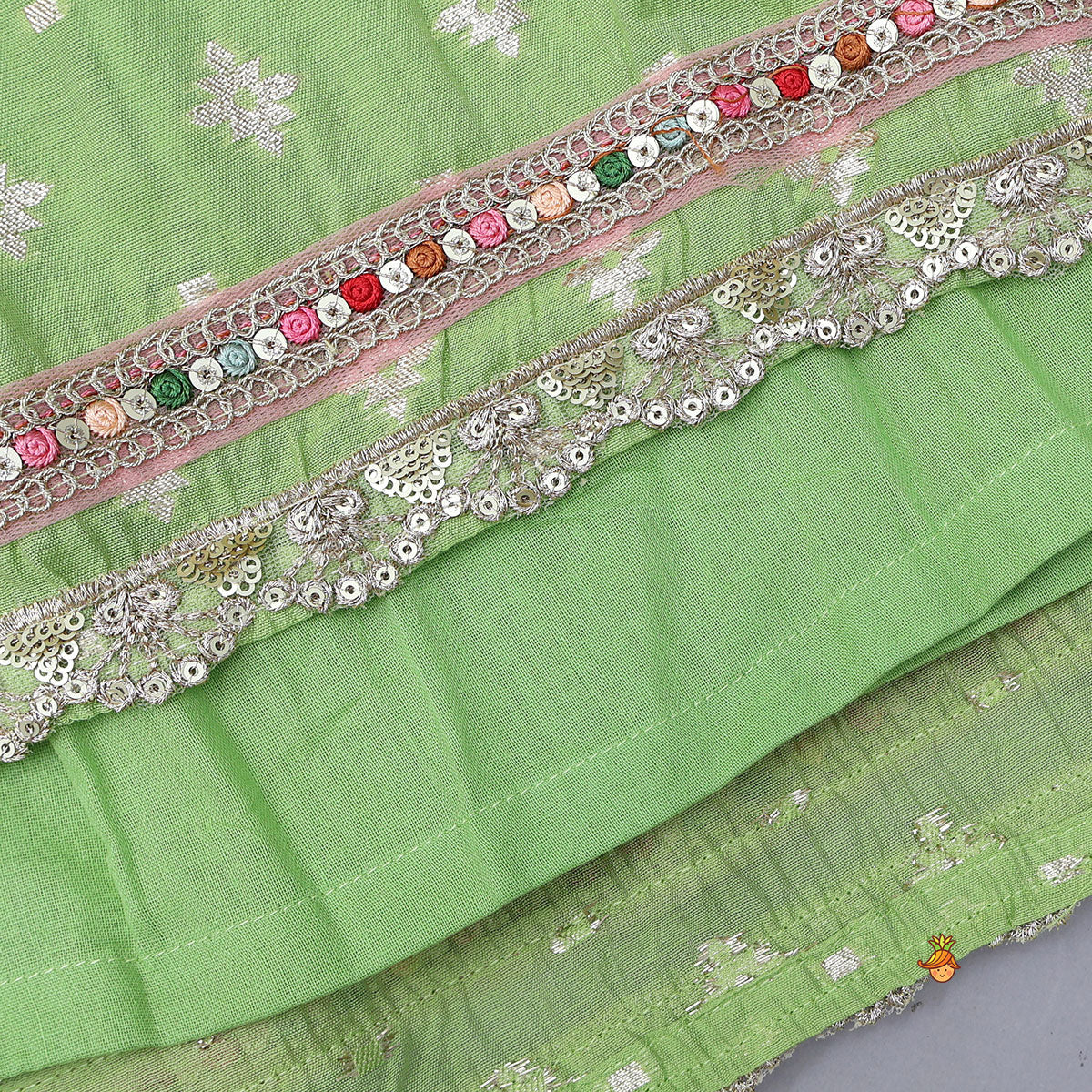 Pre Order: Pleated Hem Green Chanderi Embroidered Top And Lehenga With Net Dupatta