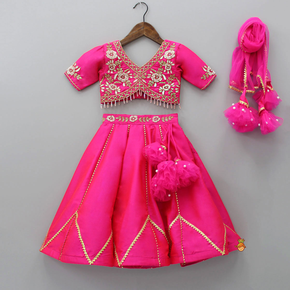 Pre Order: Floral Embroidered Pink Top And Lehenga With Matching Net Dupatta