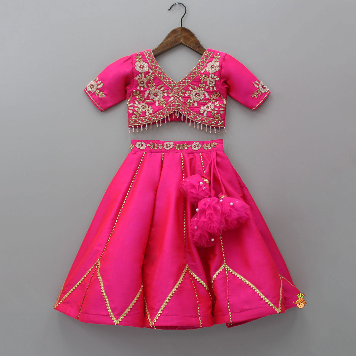 Pre Order: Floral Embroidered Pink Top And Lehenga With Matching Net Dupatta