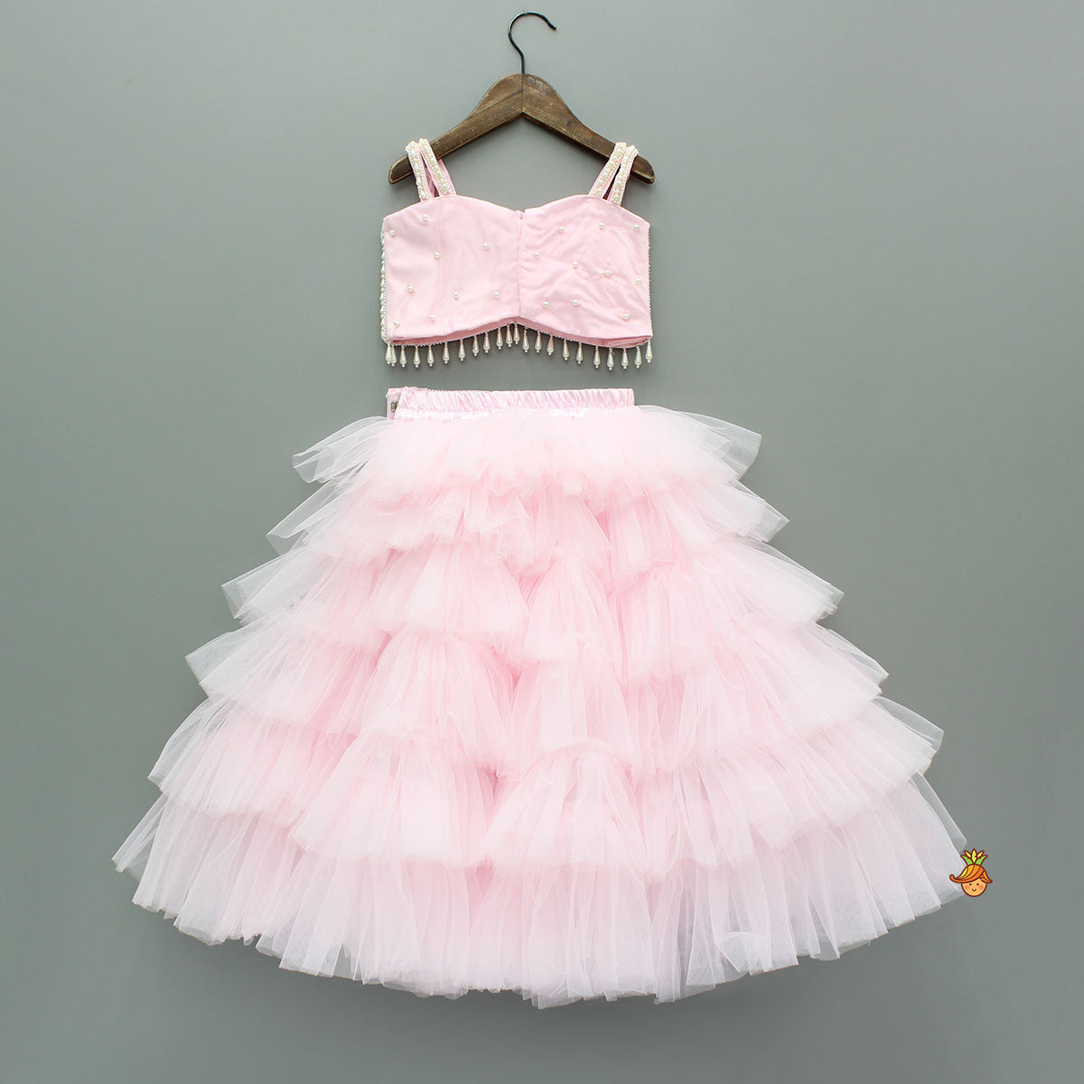 Pre Order: Pink Stylish Strappy Top And Ruffle Net Lehenga