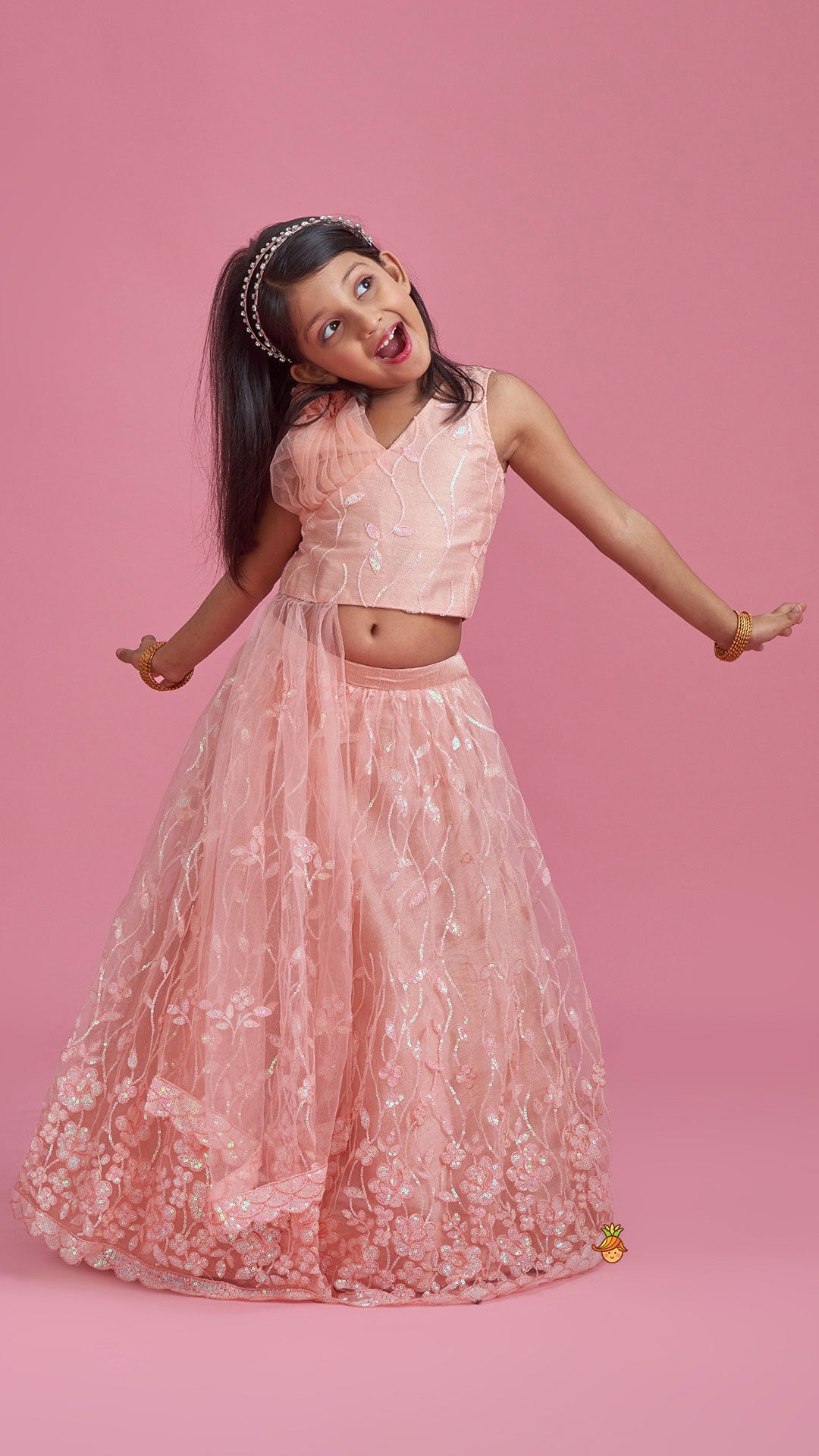 Pre Order: Elegant Peach Drape Top And Sequins Embroidered Lehenga