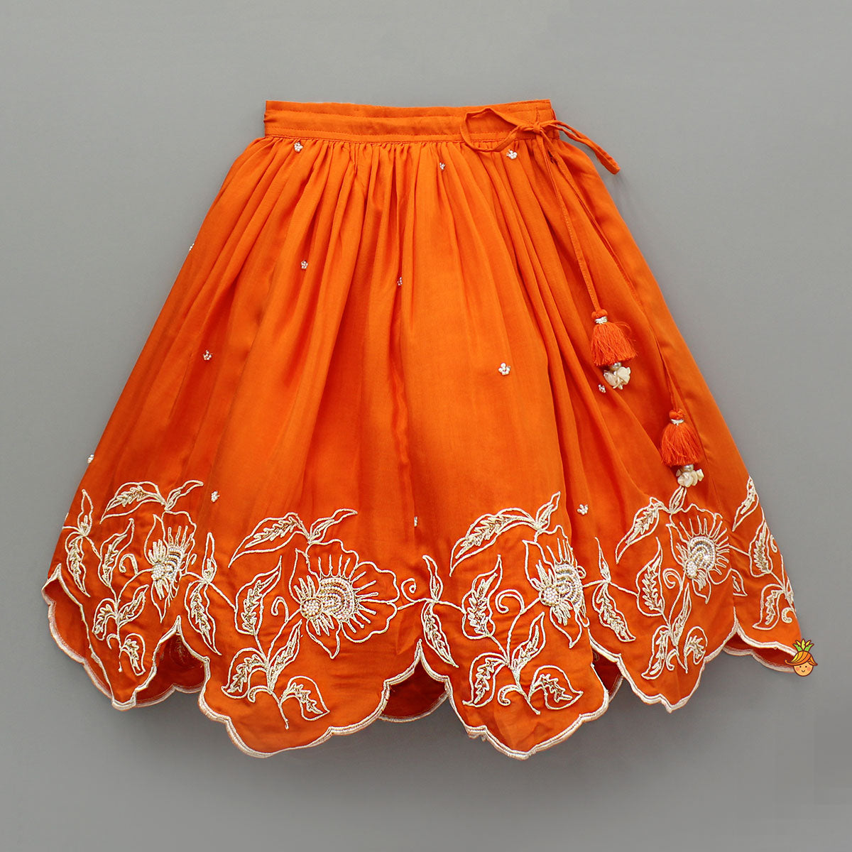 Pre Order: Orange Embroidered Dual Back Knot Detailed Top And Lehenga With Scalloped Hem Detailing