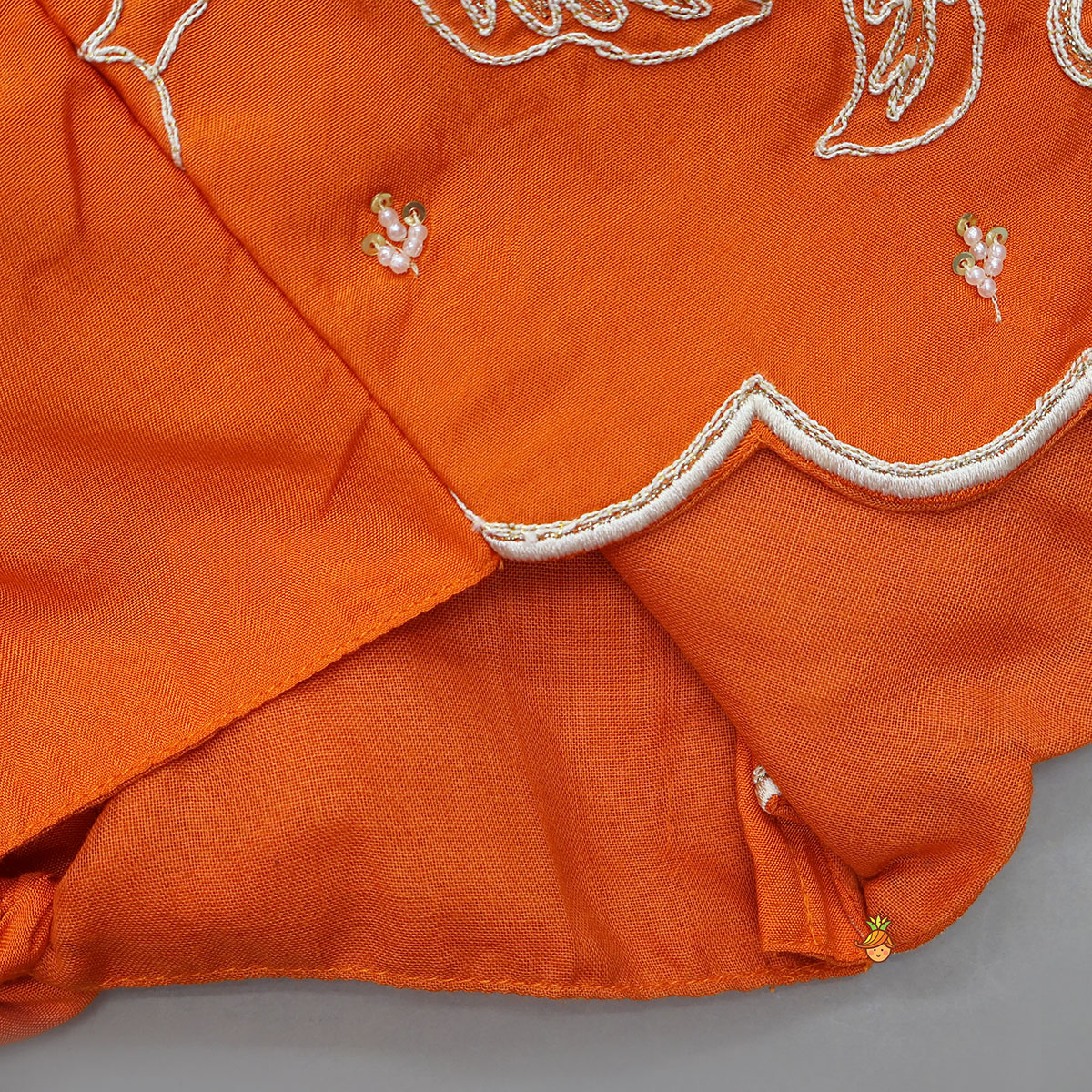 Pre Order: Orange Embroidered Dual Back Knot Detailed Top And Lehenga With Scalloped Hem Detailing