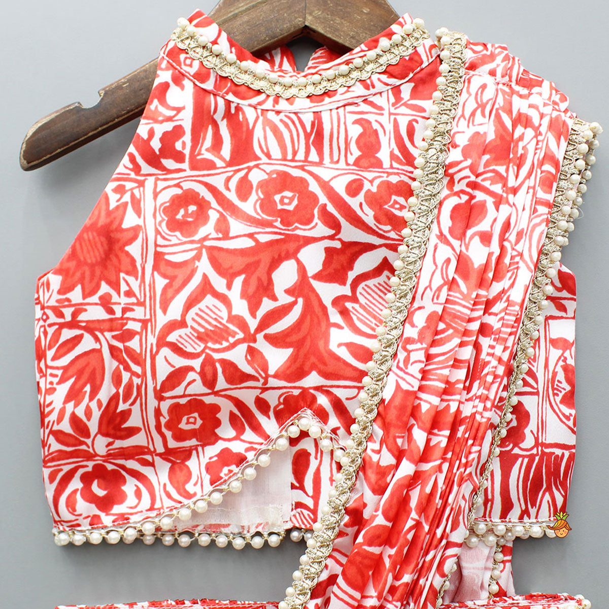 Pre Order: Red Printed Halter Neck Embellished Top And Layered Lehenga With Attached Draped Dupatta