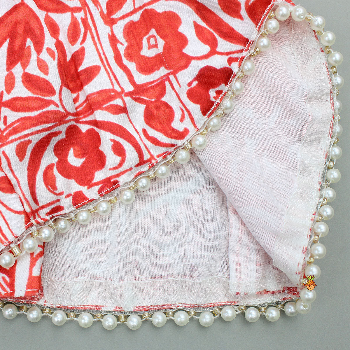 Pre Order: Red Printed Halter Neck Embellished Top And Layered Lehenga With Attached Draped Dupatta