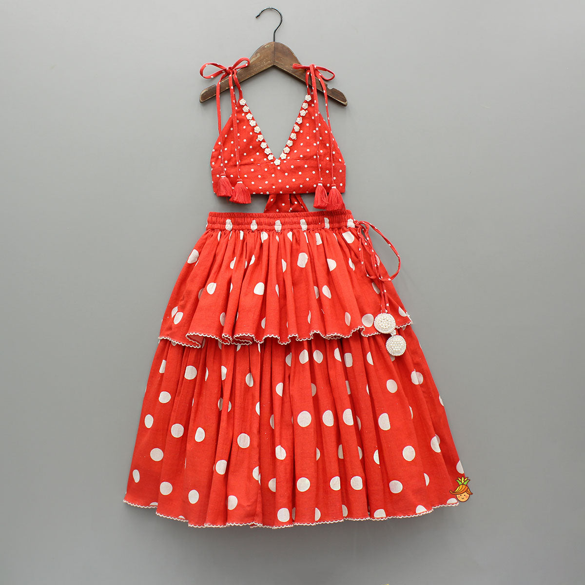 Pre Order: Red Dot Printed Tie Up Strap Top And Layered Lehenga