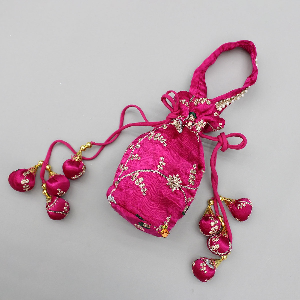 Pre Order: Pink Embroidered Top And Green Lehenga With Dupatta And Matching Potli Bag