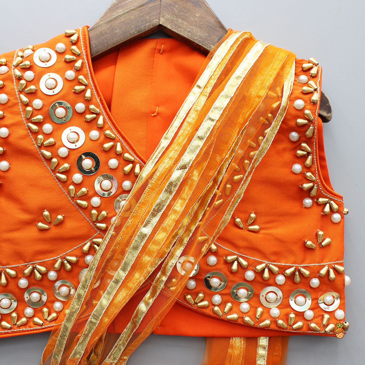 Pre Order: Orange Embroidered Top And Lehenga With Attached Dupatta