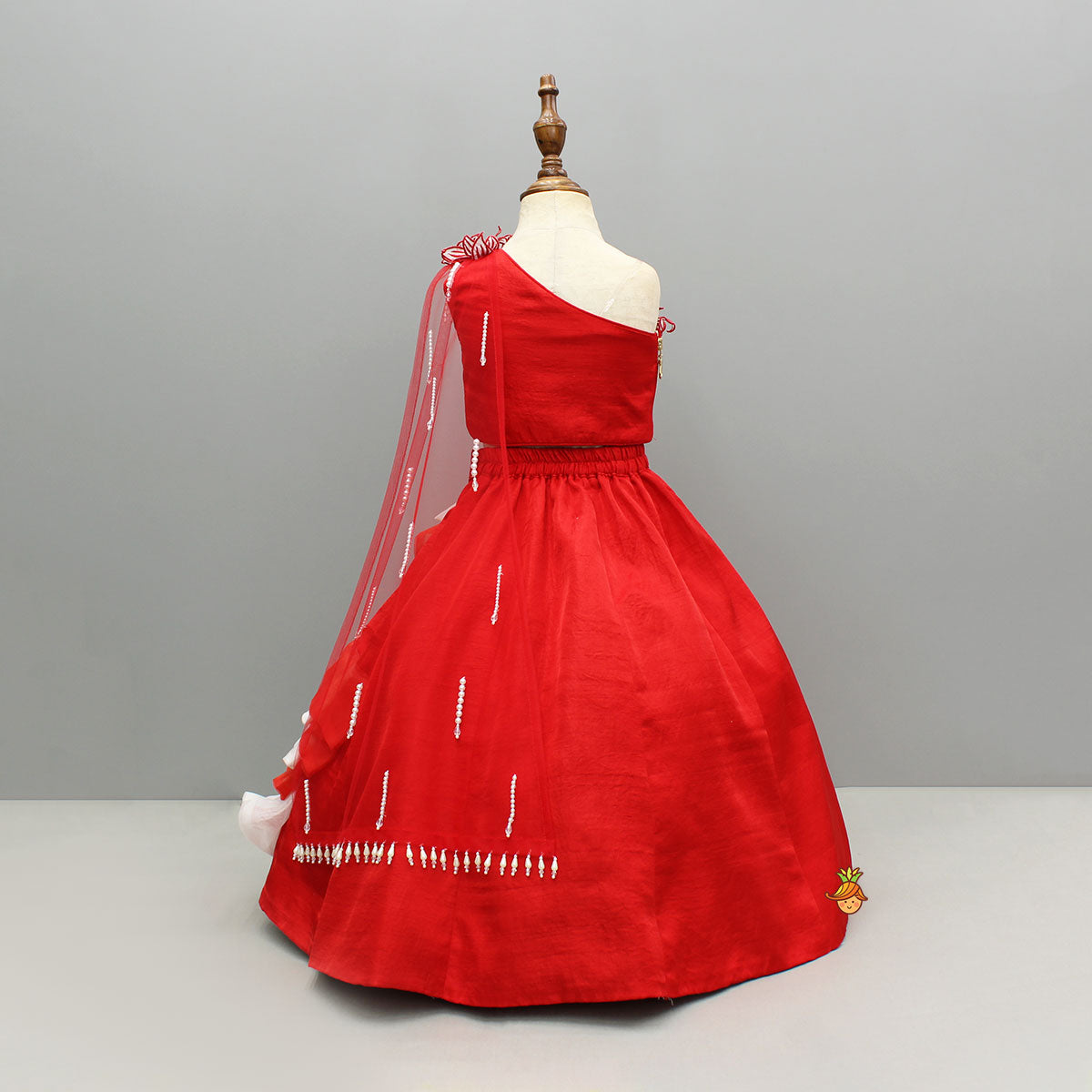 Pre Order: Red One Shoulder Embellished Top With Attached Dupatta And Stylish Lehenga