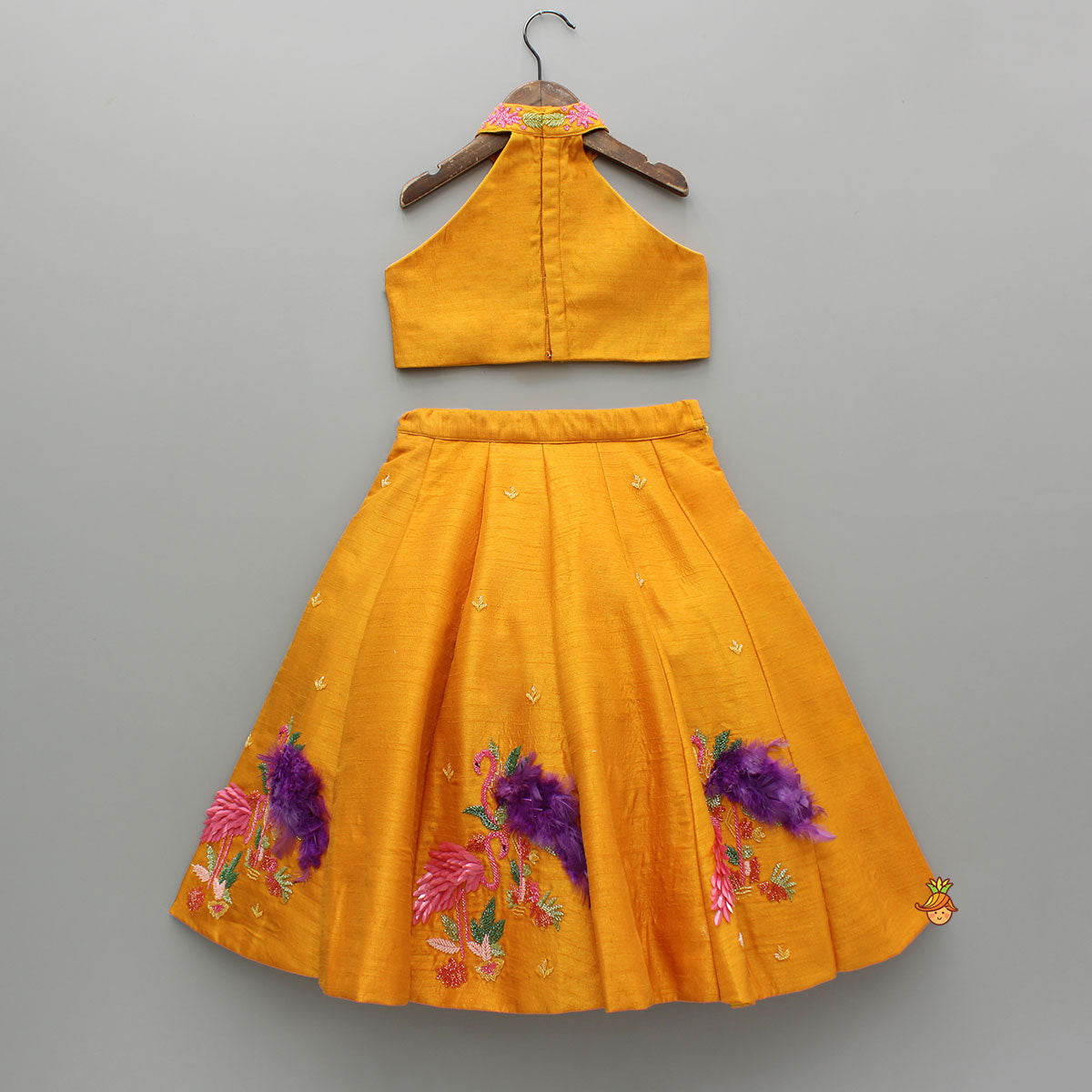 Pre Order: Floral Embroidered Halter Neck Top With Flared Lehenga And Bow Hair Clip