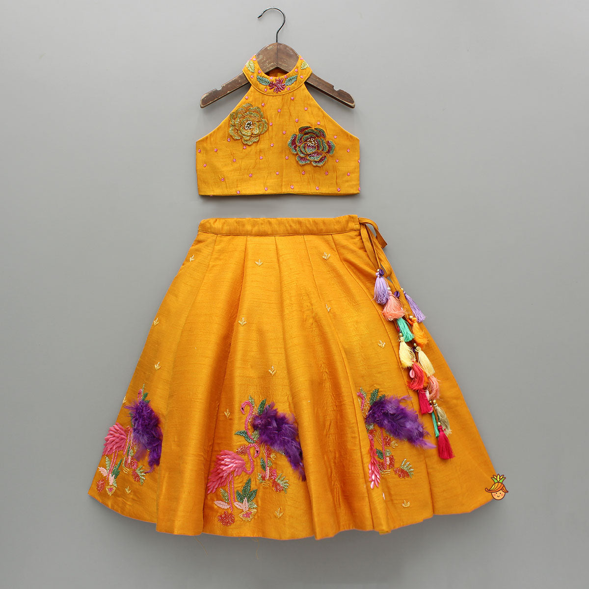 Pre Order: Floral Embroidered Halter Neck Top With Flared Lehenga And Bow Hair Clip With Potli Bag