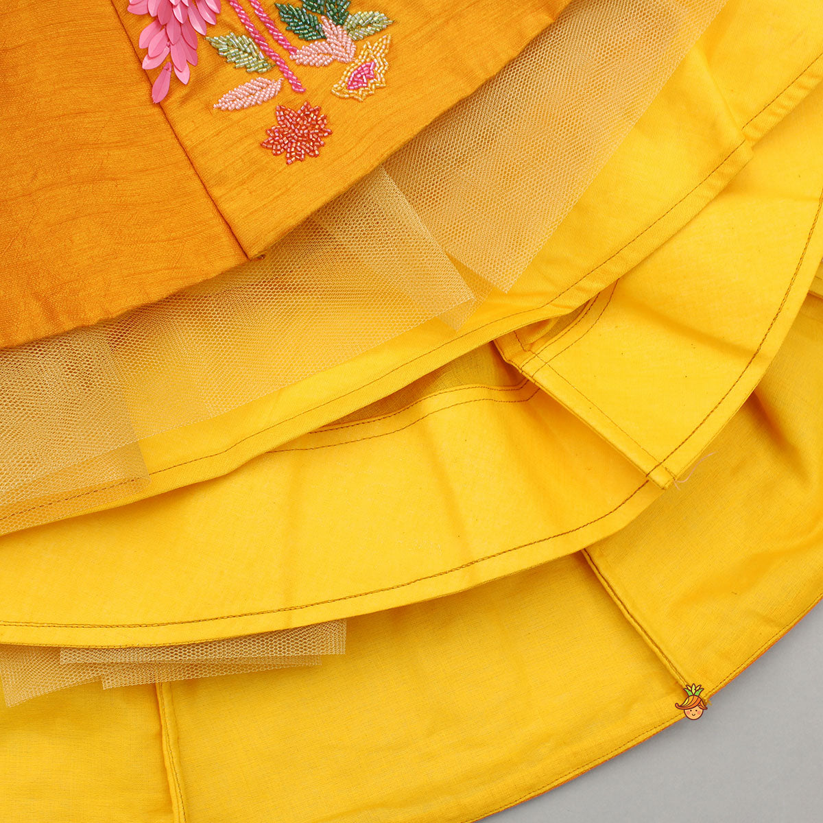 Pre Order: Floral Embroidered Halter Neck Top With Flared Lehenga And Bow Hair Clip