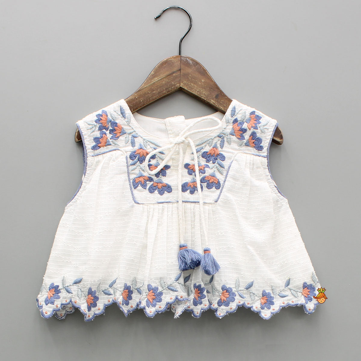 Pre Order: Cotton Top With Knot-Detailed Neckline And Ikat Printed Lehenga