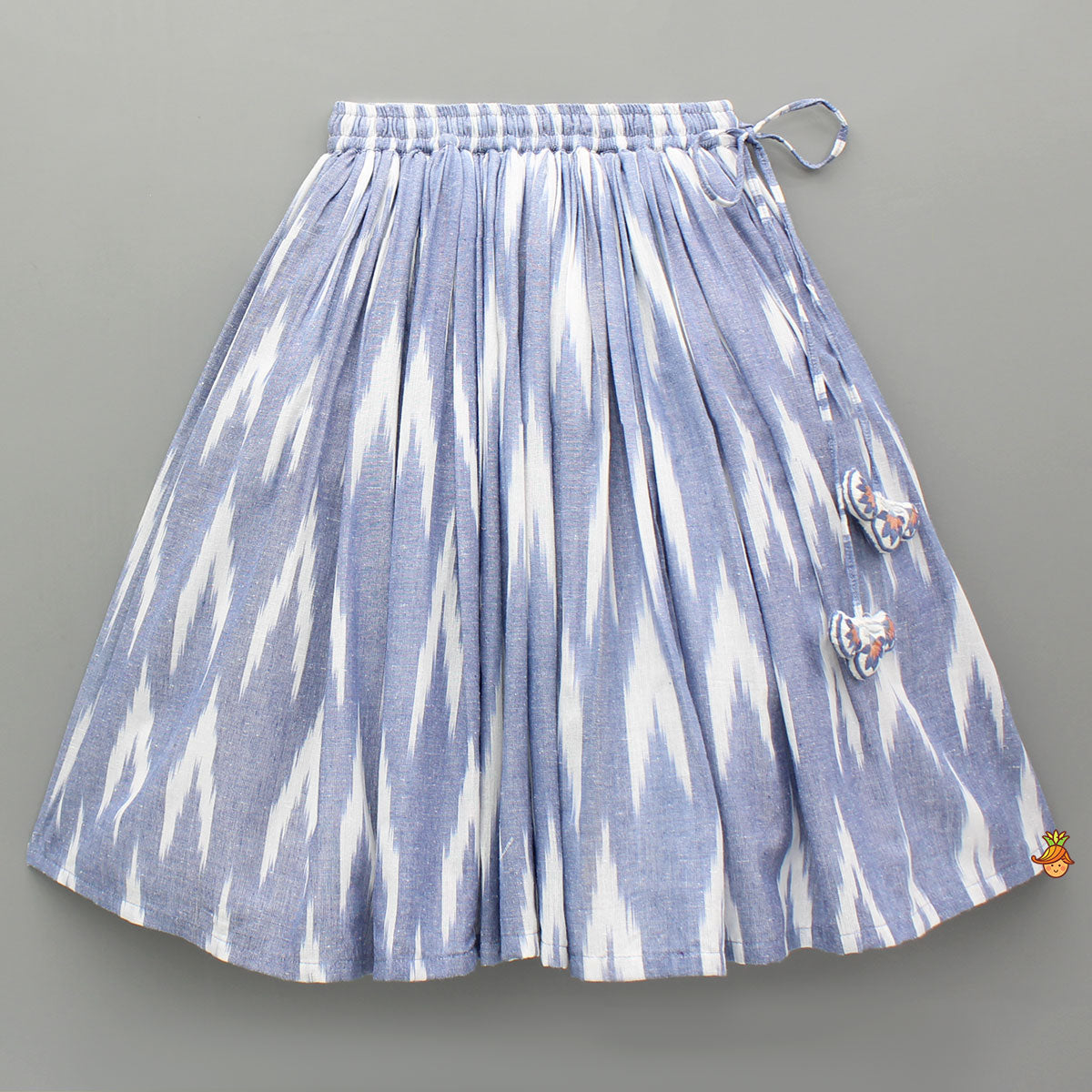 Pre Order: Cotton Top With Knot-Detailed Neckline And Ikat Printed Lehenga