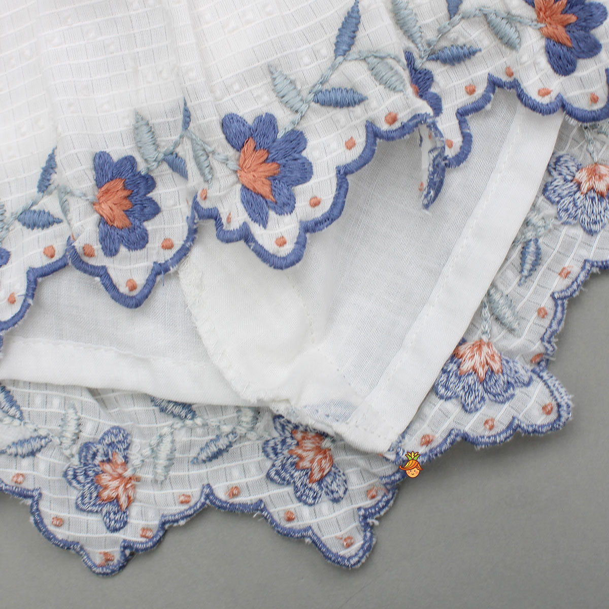 Pre Order: Cotton Top With Knot-Detailed Neckline And Ikat Printed Lehenga