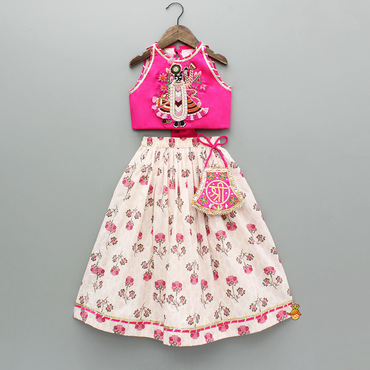 Pre Order: Goddess Embroidered Pink Top And Beautiful Tassels Embellished Lehenga With Matching Sling Bag