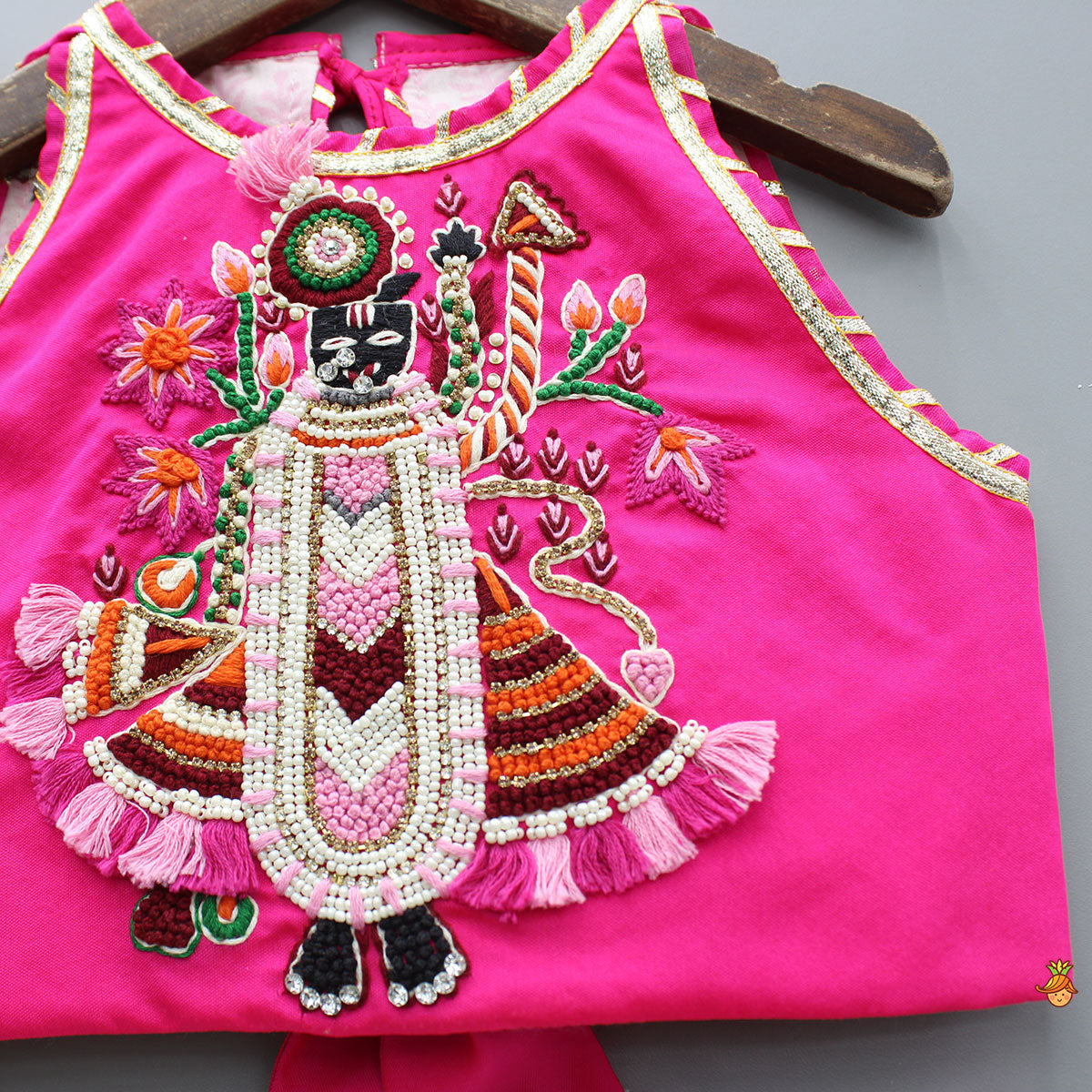 Pre Order: Goddess Embroidered Pink Top And Beautiful Tassels Embellished Lehenga With Matching Sling Bag