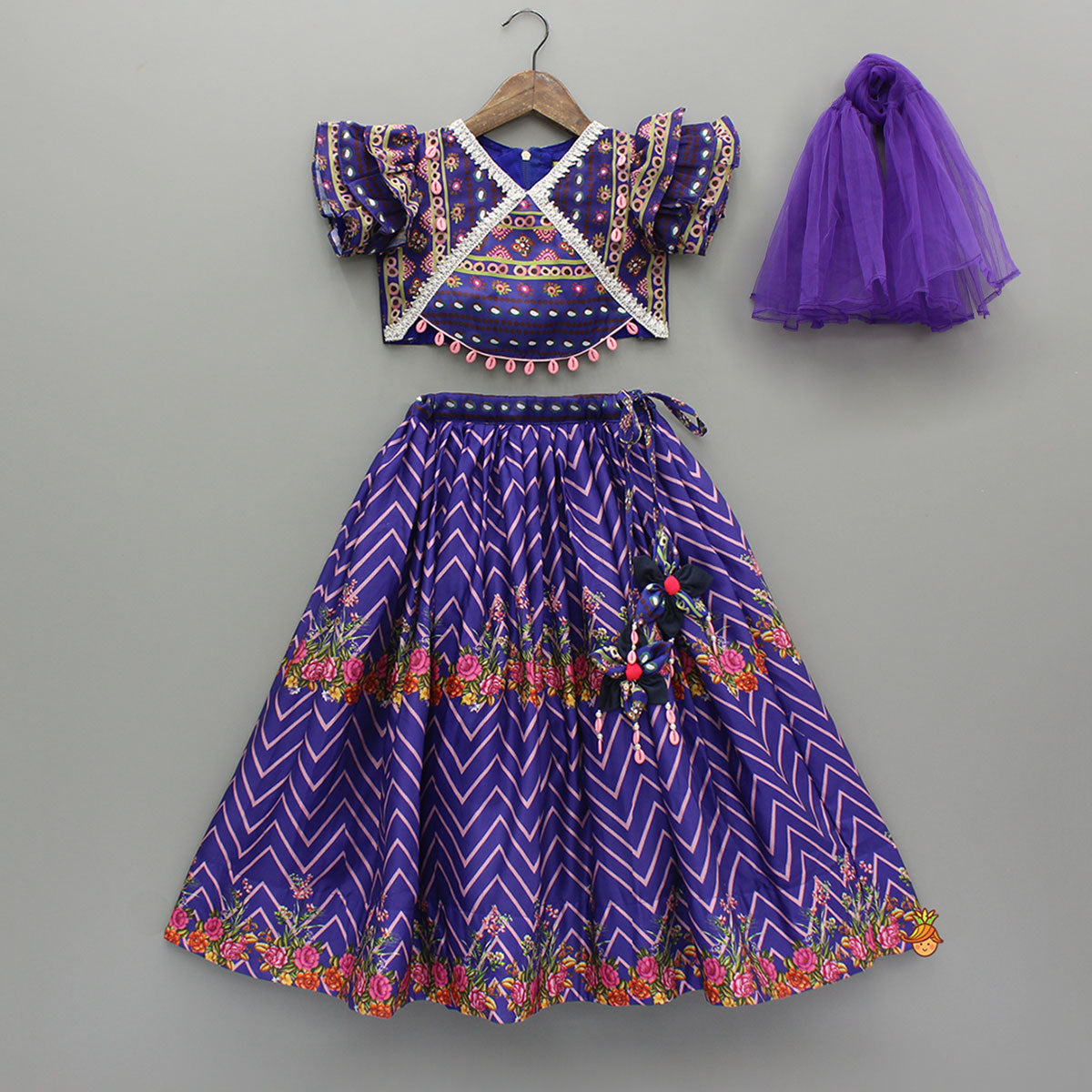 Pre Order: Layered Sleeves Blue Top And Fabric Flower Tassels Enhanced Lehenga With Purple Net Dupatta