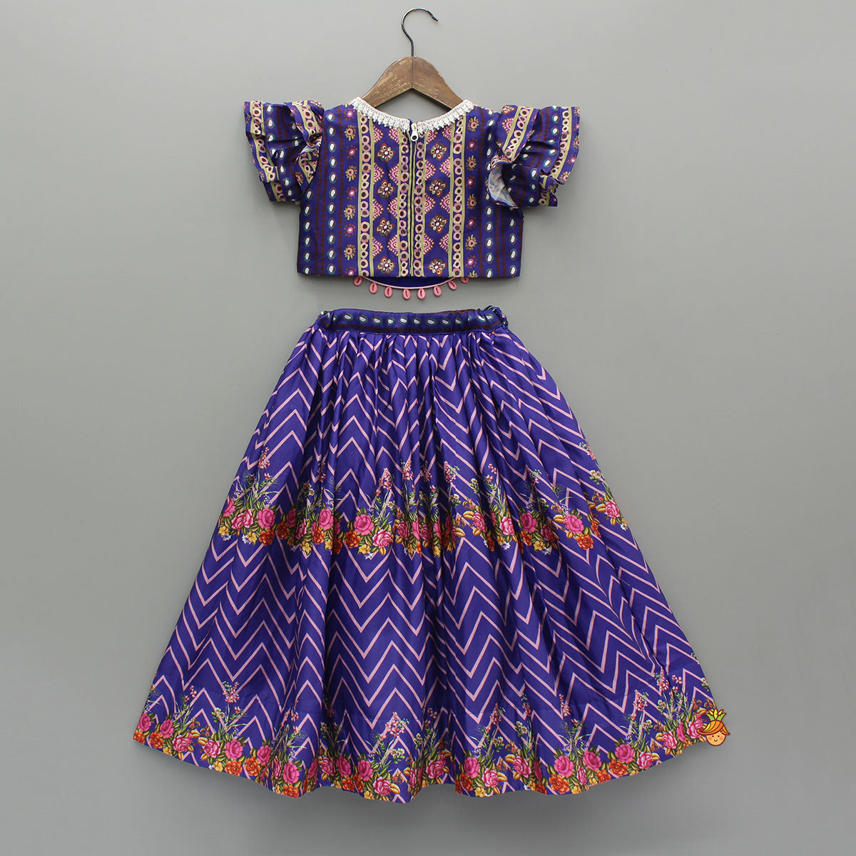 Pre Order: Layered Sleeves Blue Top And Fabric Flower Tassels Enhanced Lehenga With Purple Net Dupatta