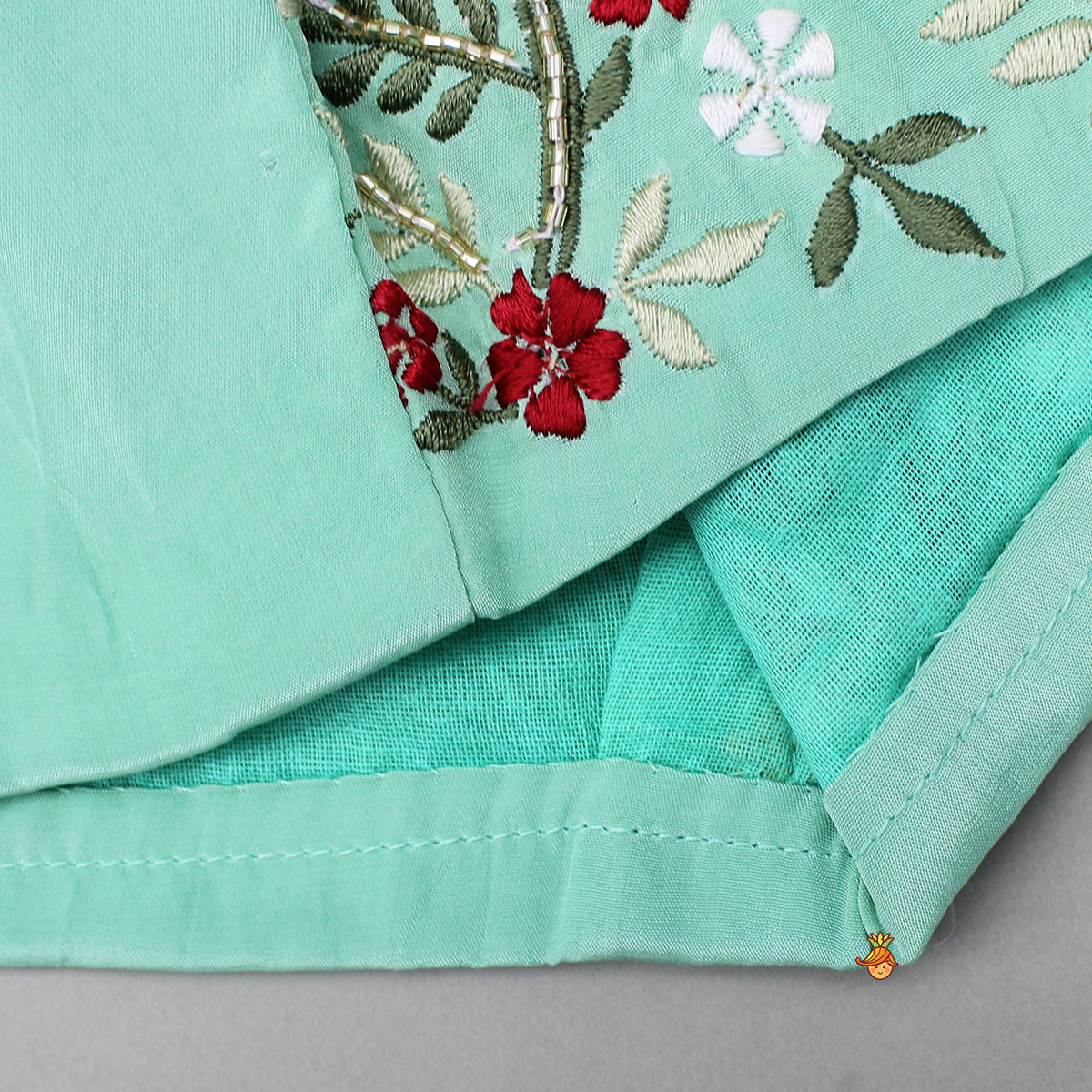 Pre Order: Beautiful Floral Embroidered Green Top With Asymmetrically Layered Lehenga