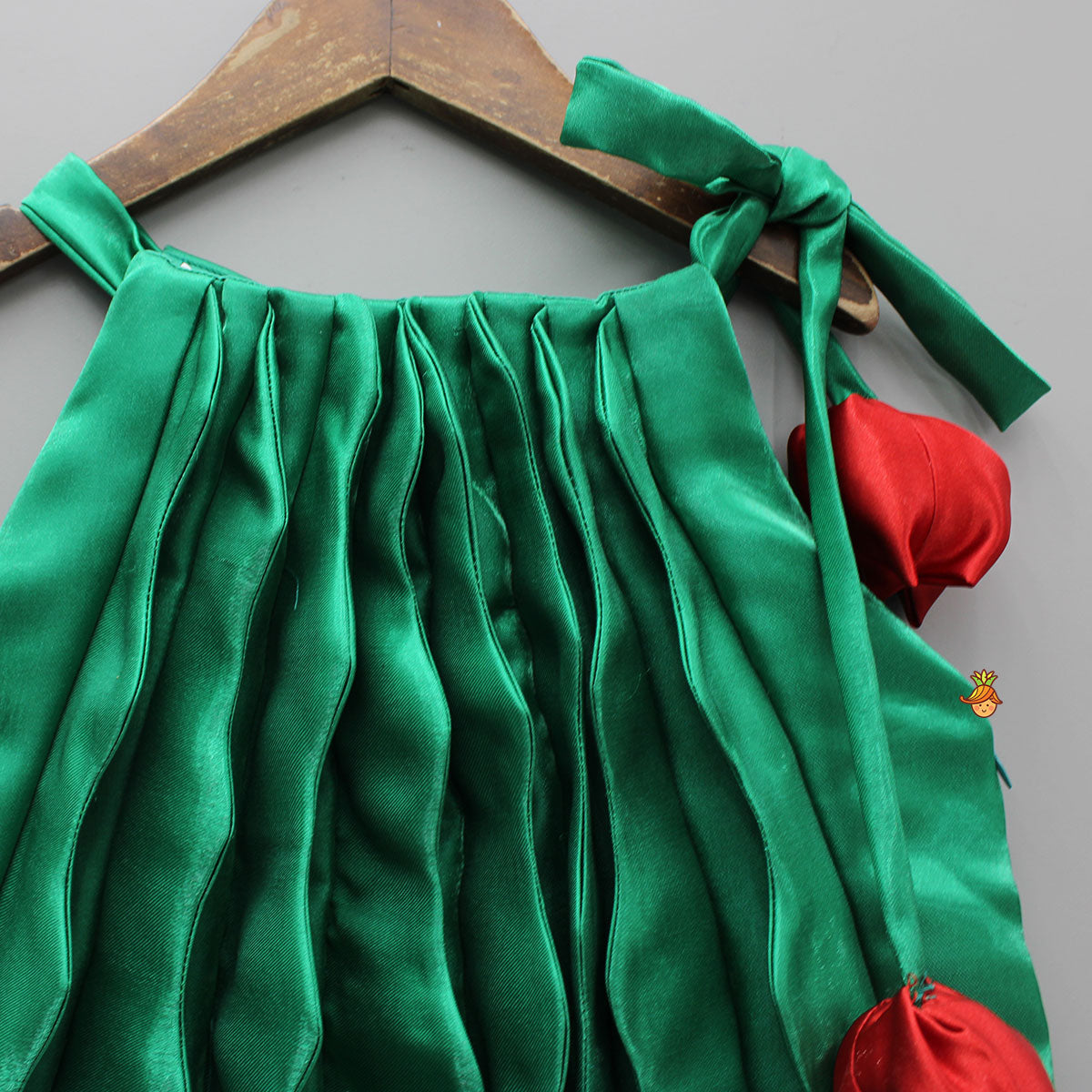 Pre Order: Sheen Green Satin Pleated Dress With Red Floral Tie-Up Detail