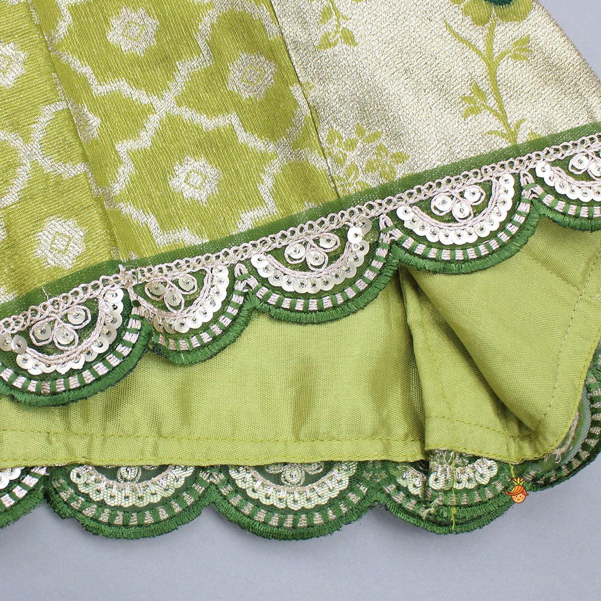 Pre Order: Green Scallop Brocade Top With Pleat Detailed Brocade Lehenga
