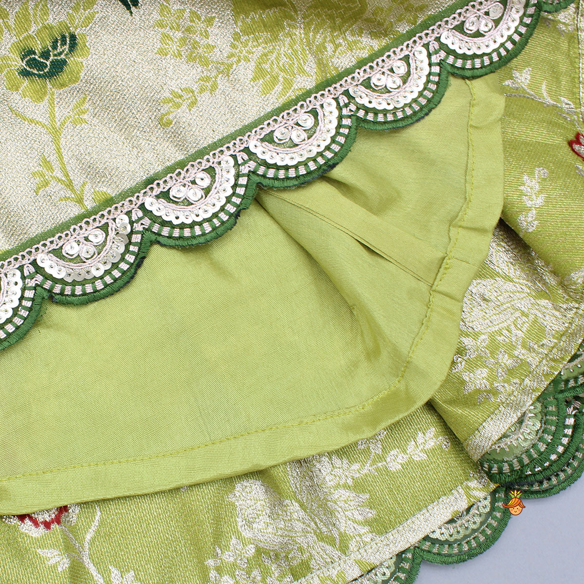 Pre Order: Green Scallop Brocade Top With Pleat Detailed Brocade Lehenga