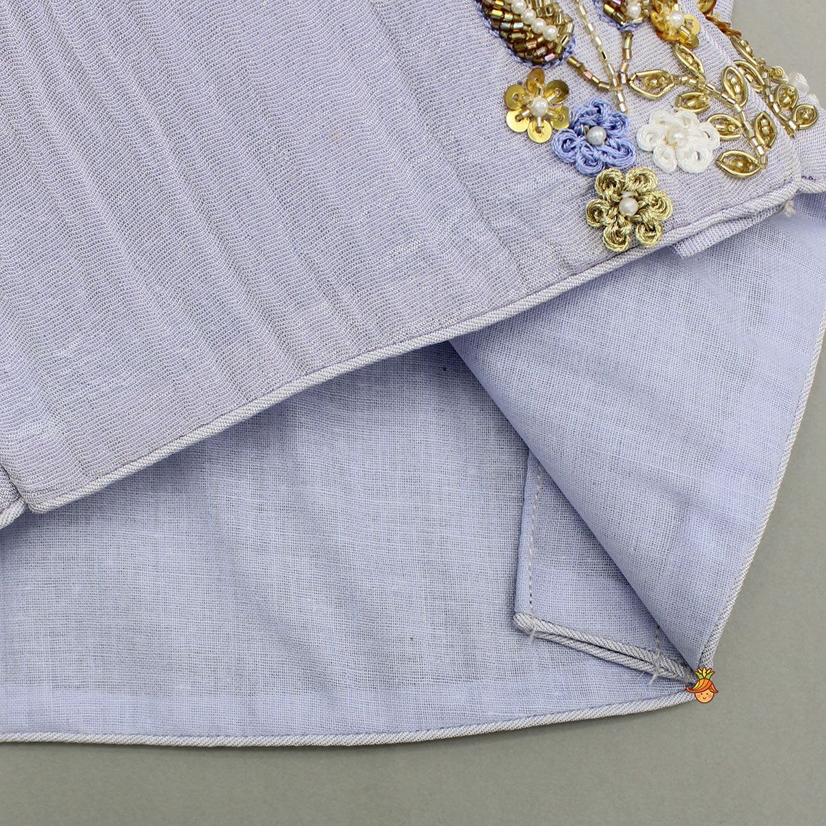 Pre Order: Sleeveless Floral Embroidered Sheen Lavender Top With Shimmery Lehenga