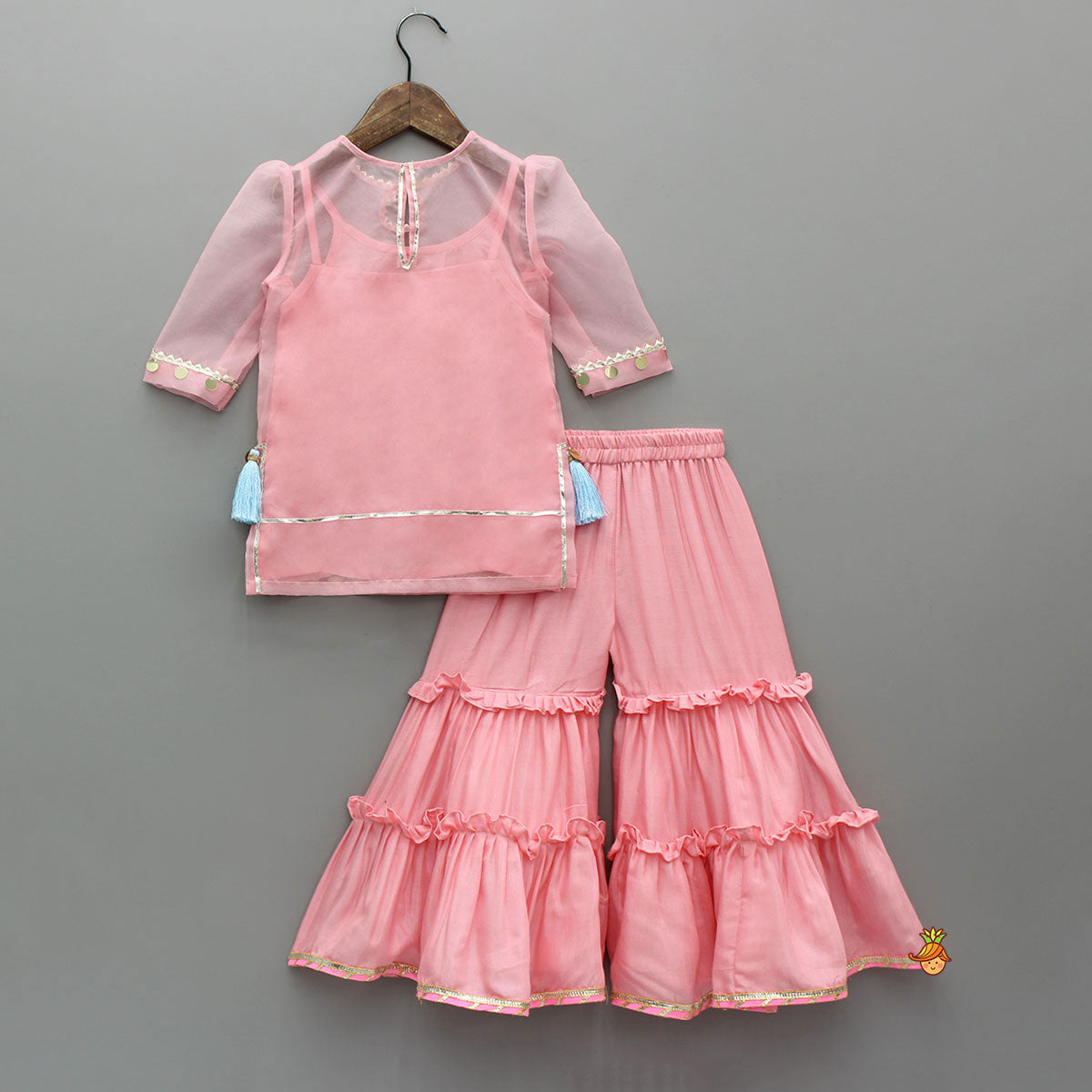 Pre Order: Elegant Strappy Top With Embellished Kurti And Ruffled Sharara With Dupatta