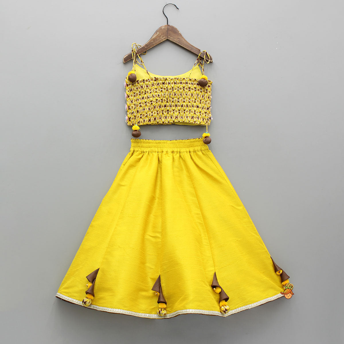 Pre Order: Flowers Adorned Smocked Tie Up Top With Lehenga And Waist Belt