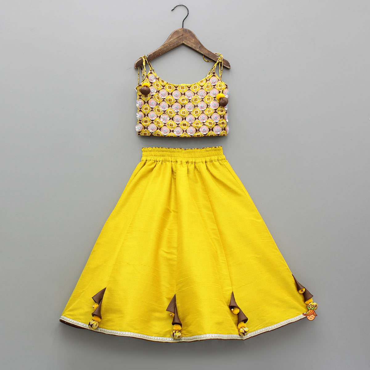 Pre Order: Flowers Adorned Smocked Tie Up Top With Lehenga And Waist Belt