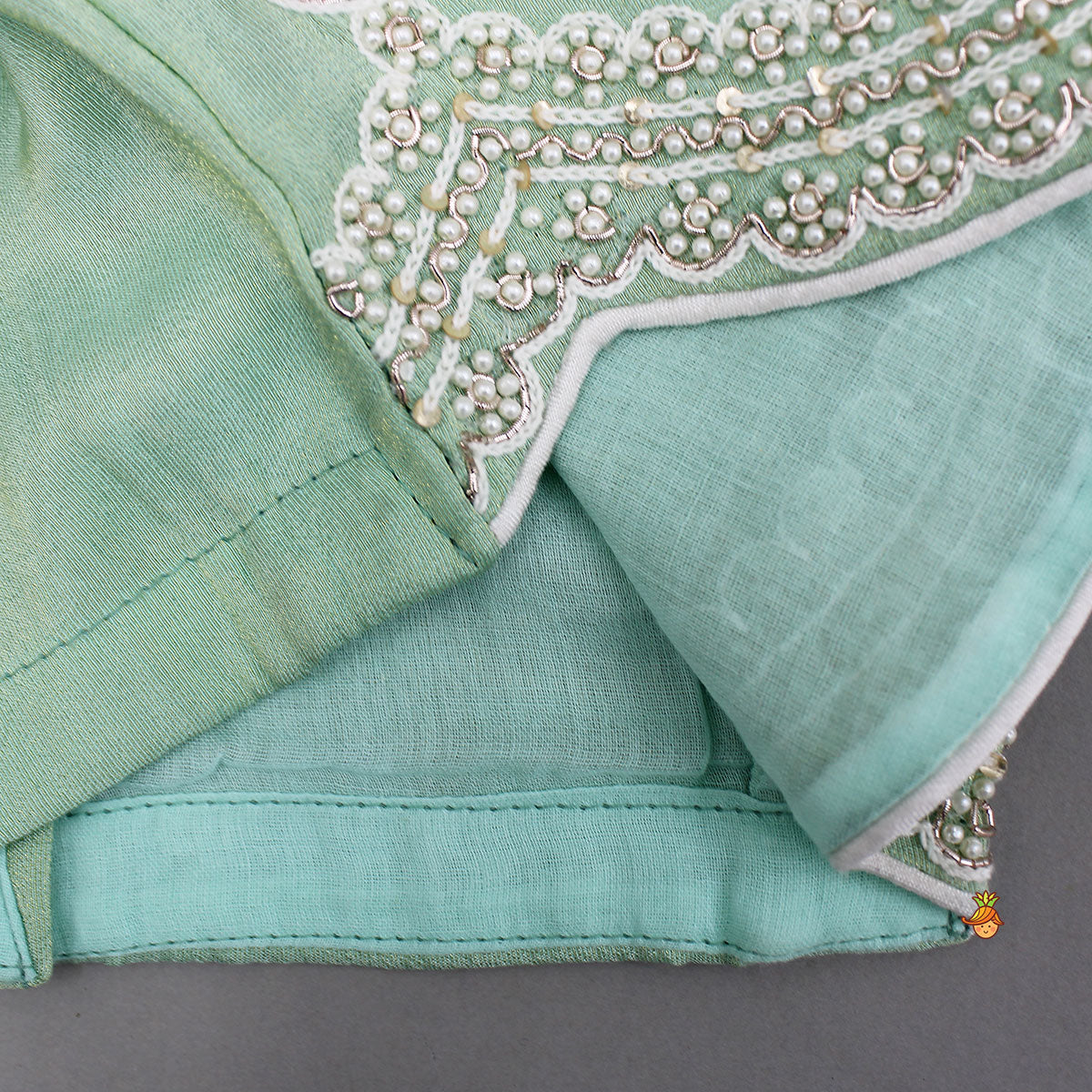 Pre Order: Stylish Hem Embroidered Top And Scalloped Lehenga