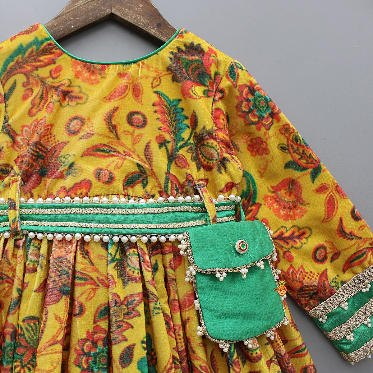 Pre Order: Printed Velvet Anarkali With Embroidered Pouch And Matching Hairband