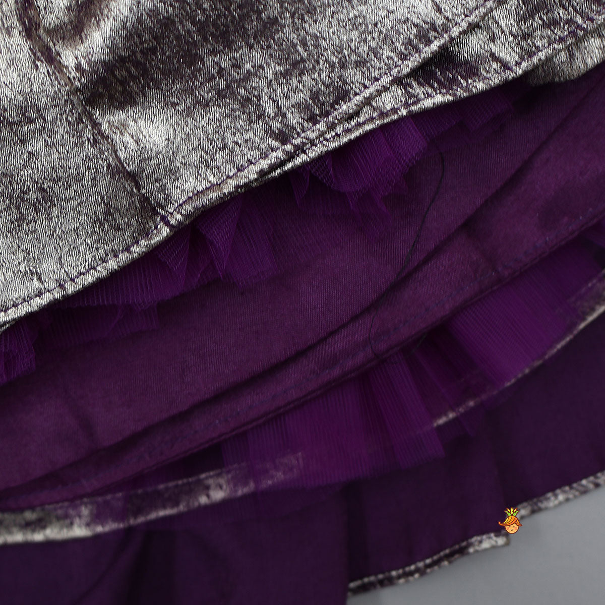 Pre Order: Sleeveless Shiny Top With Layered Lehenga And Attached Dupatta