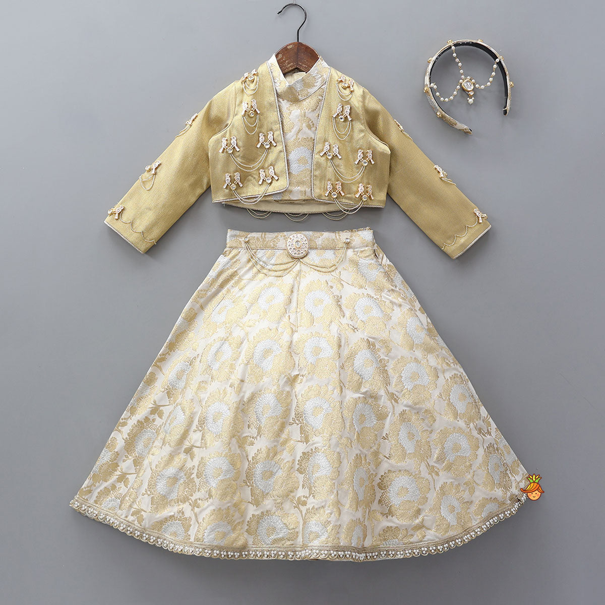 Pre Order: Exquisite Halter Neck Brocade Top With Embellished Jacket And Brocade Lehenga With Matching Hair Band