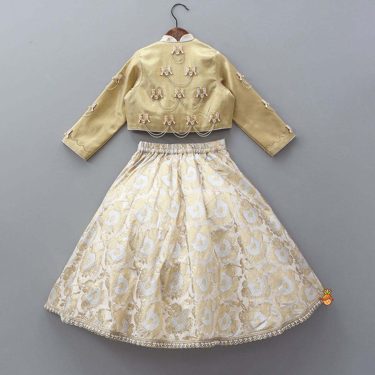 Pre Order: Exquisite Halter Neck Brocade Top With Embellished Jacket And Brocade Lehenga With Matching Hair Band