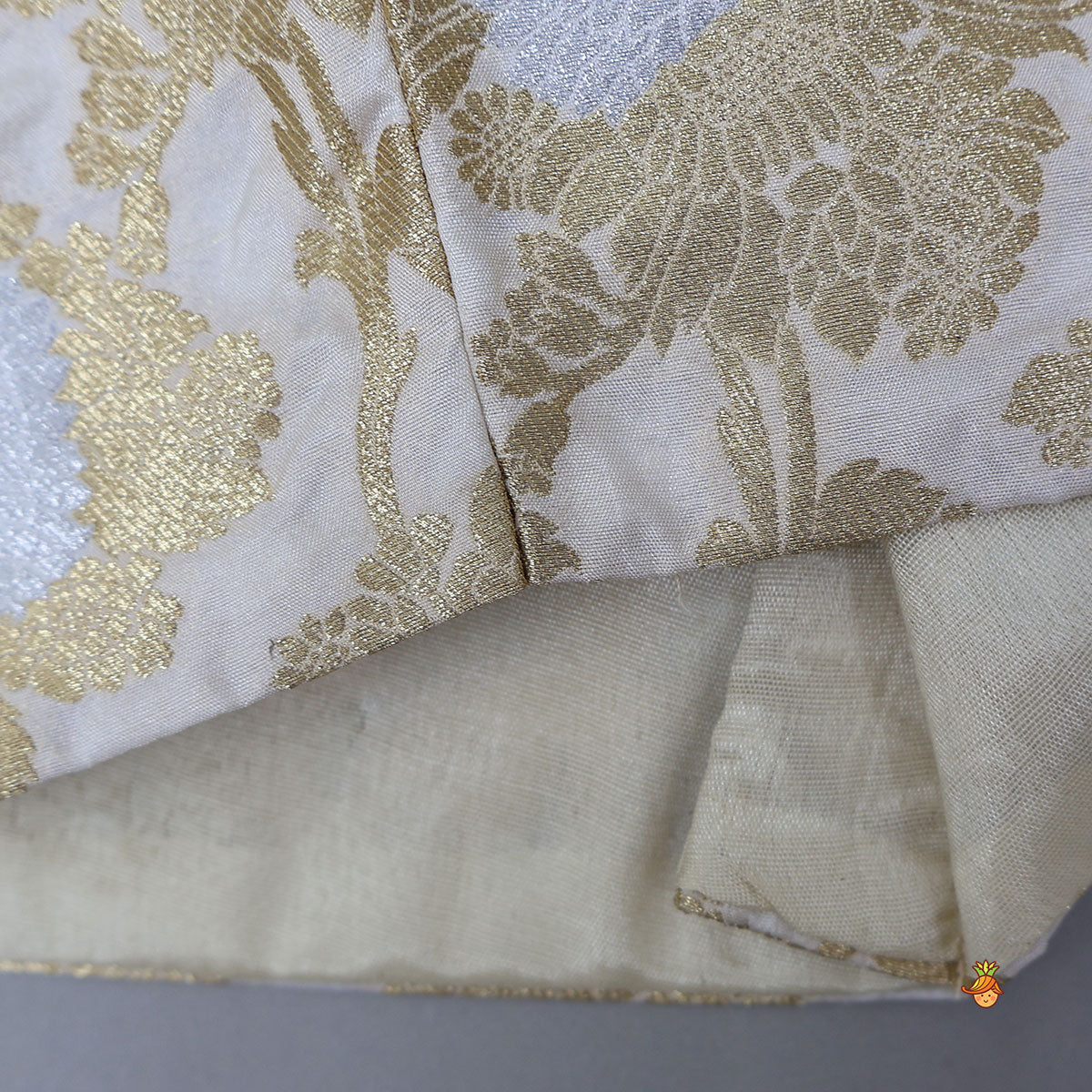 Pre Order: Exquisite Halter Neck Brocade Top With Embellished Jacket And Brocade Lehenga With Matching Hair Band